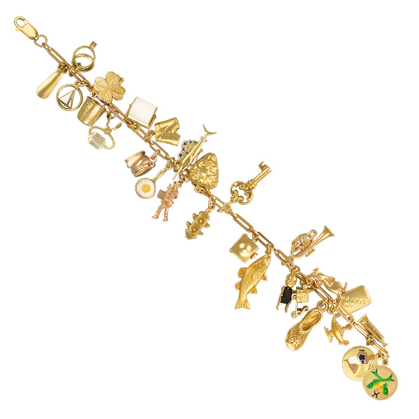 Assorted charm bracelet in 14k yellow gold. Length 7.5 inches. image 1