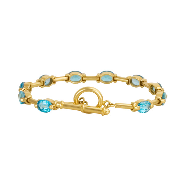 Bright toggle oval cut blue topaz bracelet in 18k with image 2