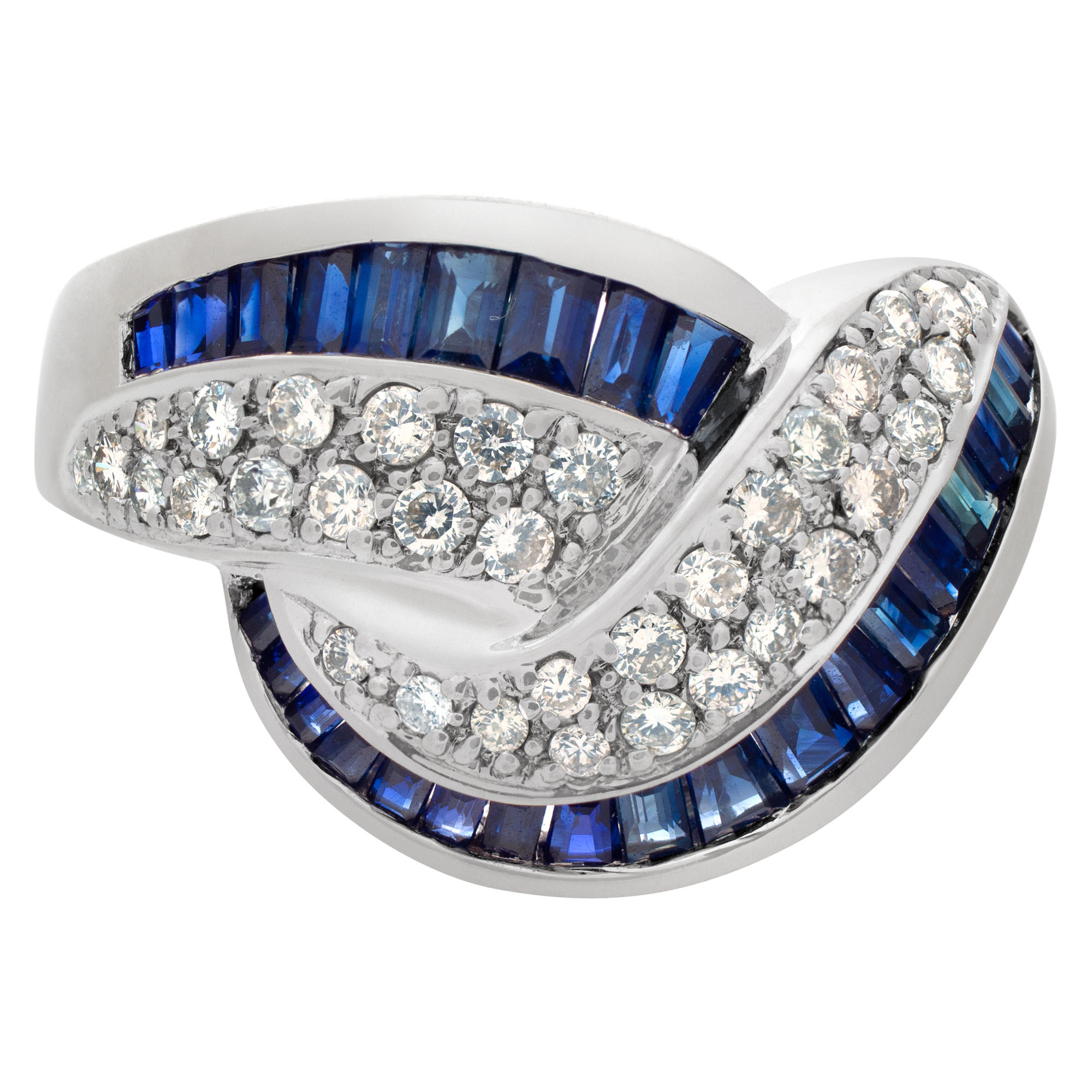 Criss-Cross sapphire & diamond ring in 14K white gold. Approx 1 carat tapered emerald cut sapphire and 0.75 carat full cut round diamond. image 2