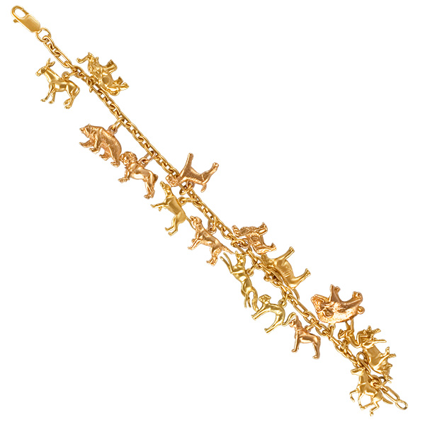 Assorted animals charm bracelet in 14k; 7" long