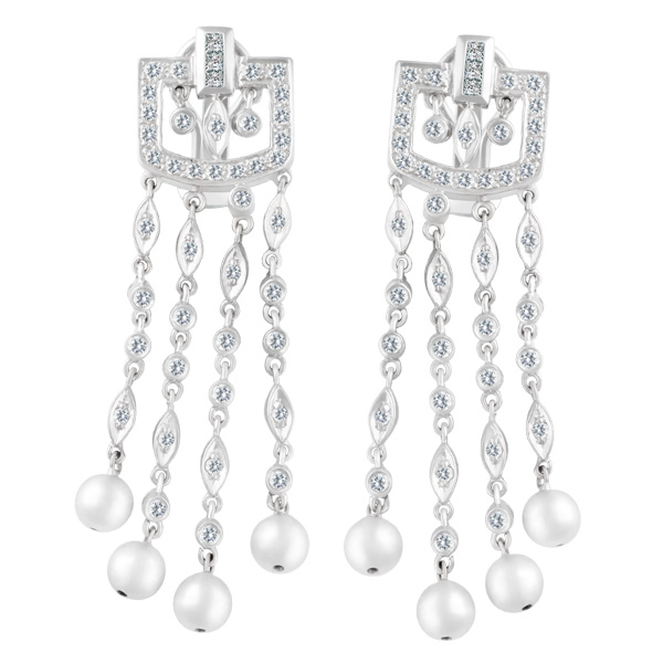 Dangle diamond earrings In 18k white gold. 1.00 carats in diamonds