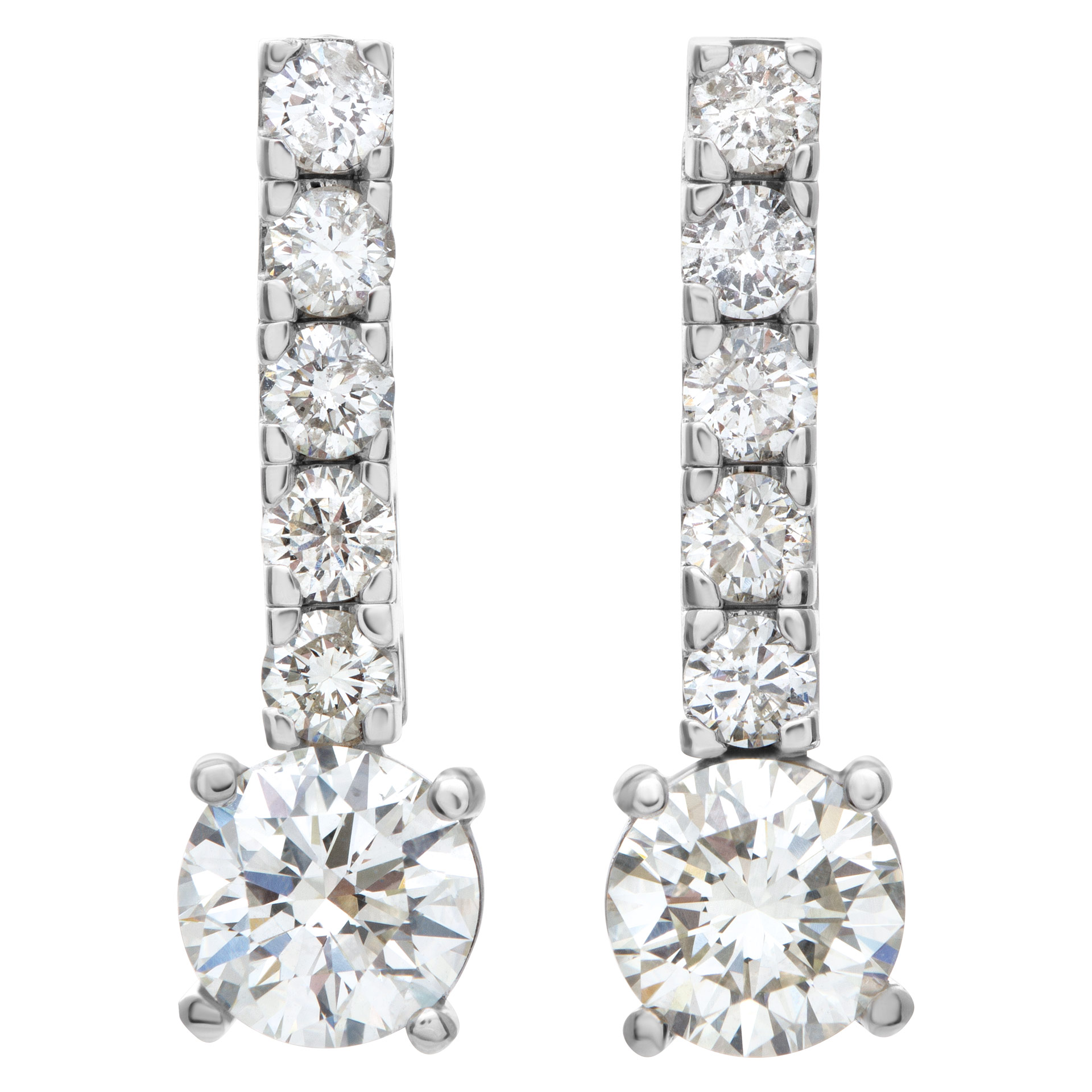 Line of diamond earrings. Approx. 1 carat each with additional 1 ct in line.