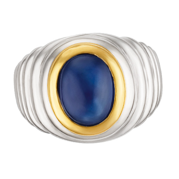 Ribbed 18k white gold ring with a cabachon sapphire set in an 18k yellow gold bezel