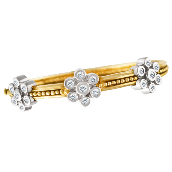 Bangle in 14k white and yellow gold with 3 diamond flowers
