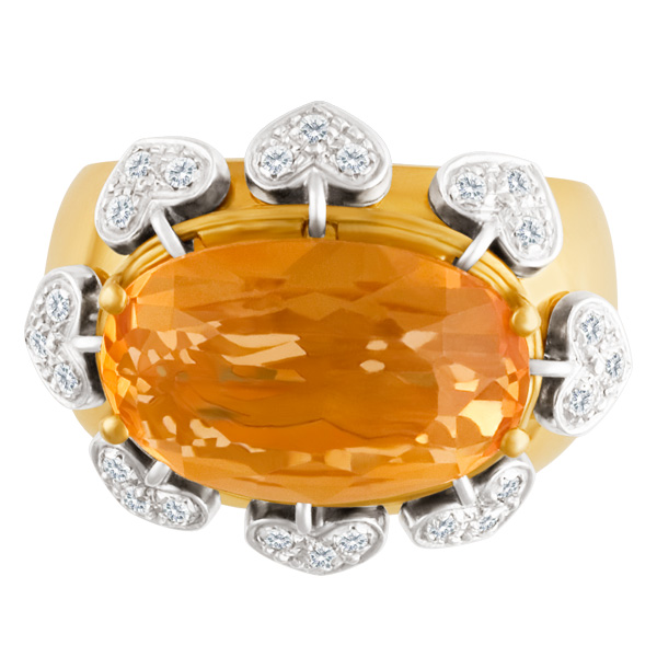 Bright and modern diamond ring with moving hearts surrounding a faceted citrine