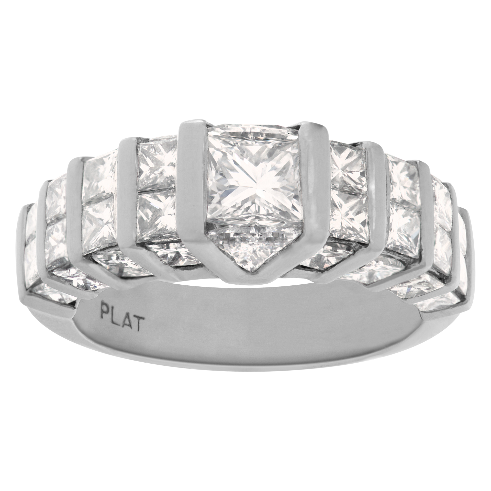 Platinum diamond band with channel set princess cut & trillion cut diamonds. 3.95cts