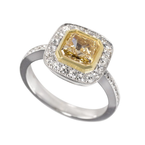 Fancy yellow and  white diamond ring in 18k white gold
