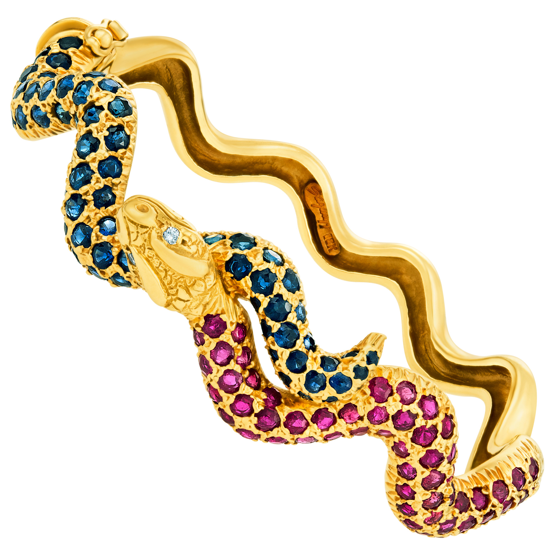 Sazingg 18k snake swirl bangle with app. 3 carats in blue sapphires and rubbies