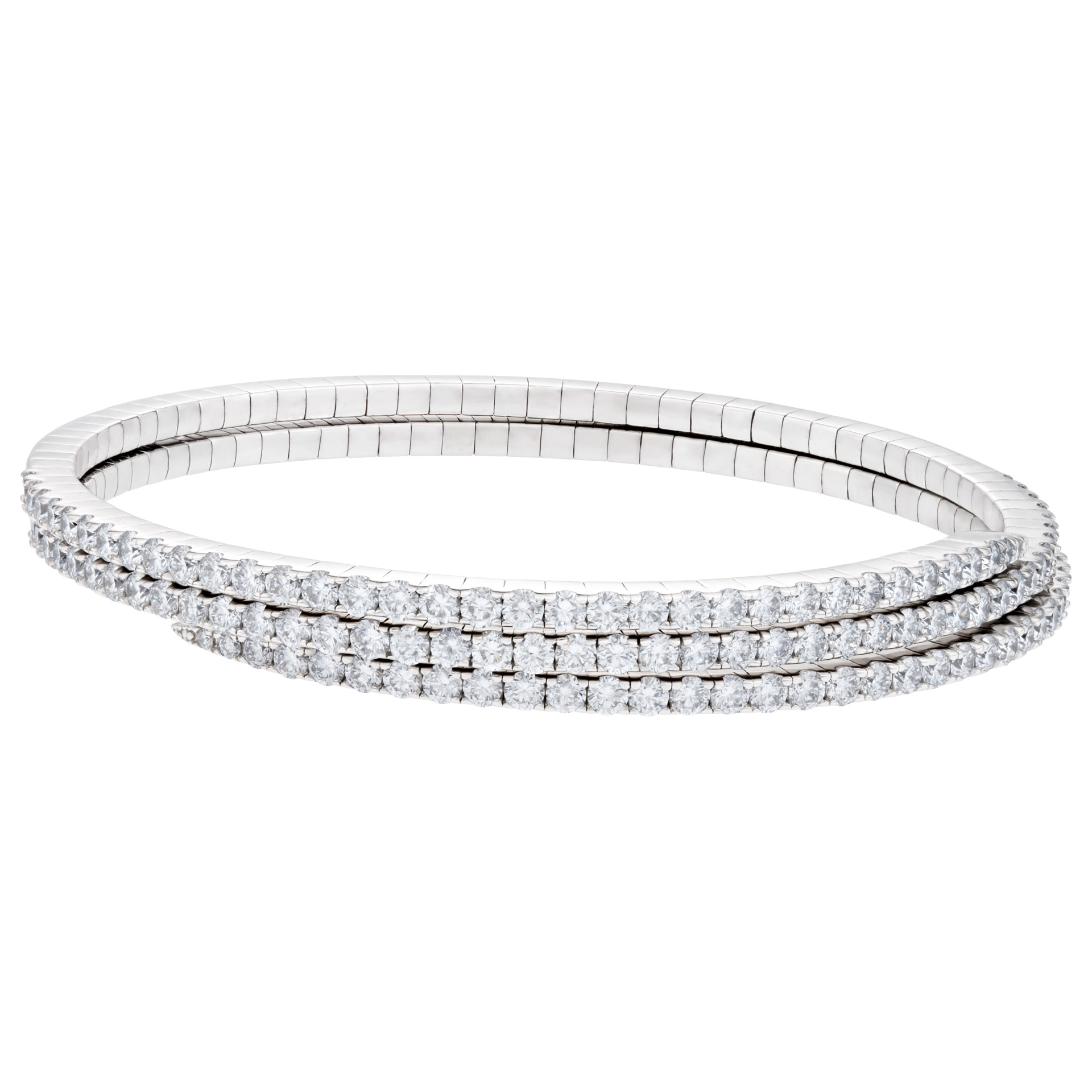 Flexible diamond coil bangle in 18k white gold. 7.32 carats in round diamonds.