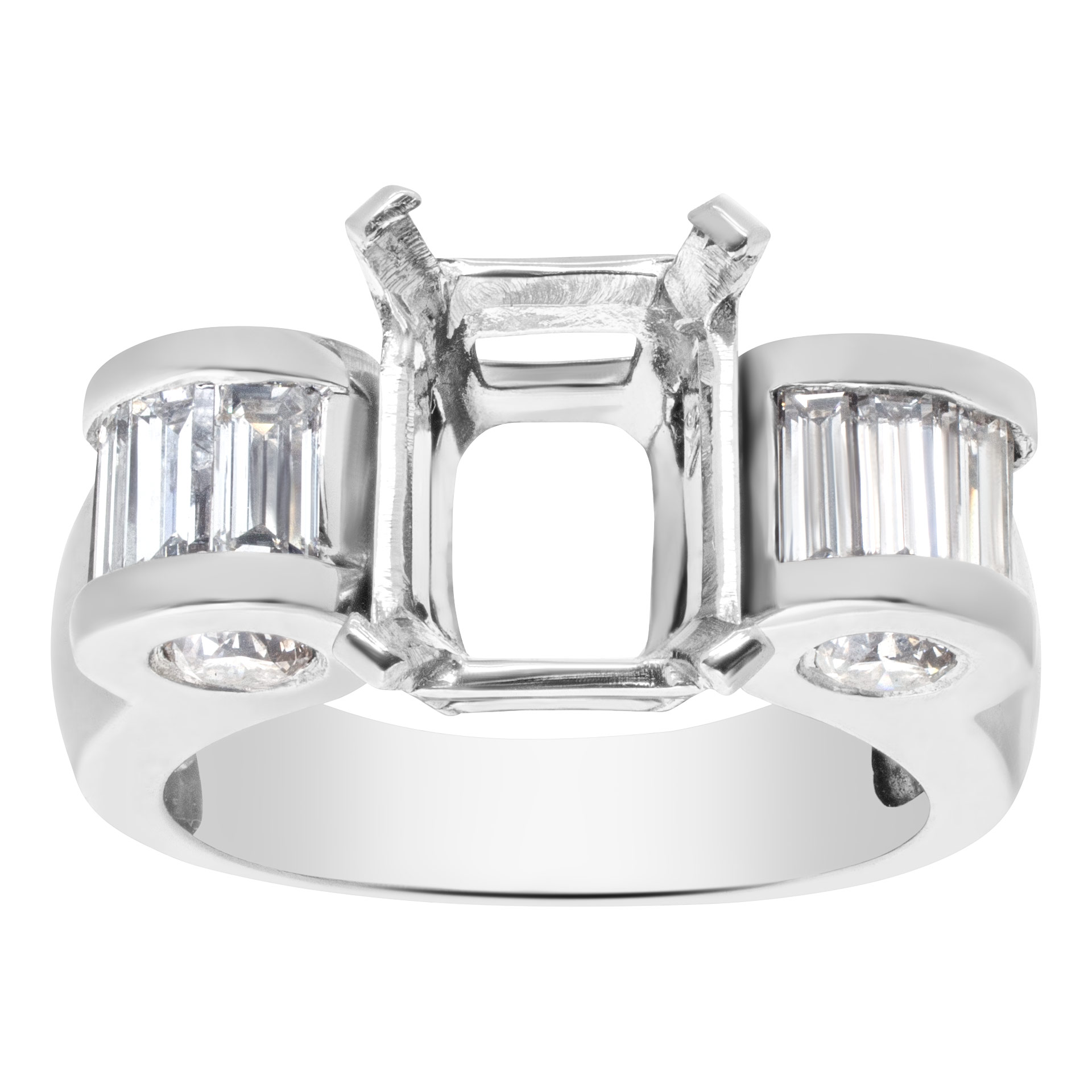 Unusual Setting for approx 2 to 2 1/2 carat Emerald cut stone in Platinum with approx 1 carat round and bsaguette cut stone.