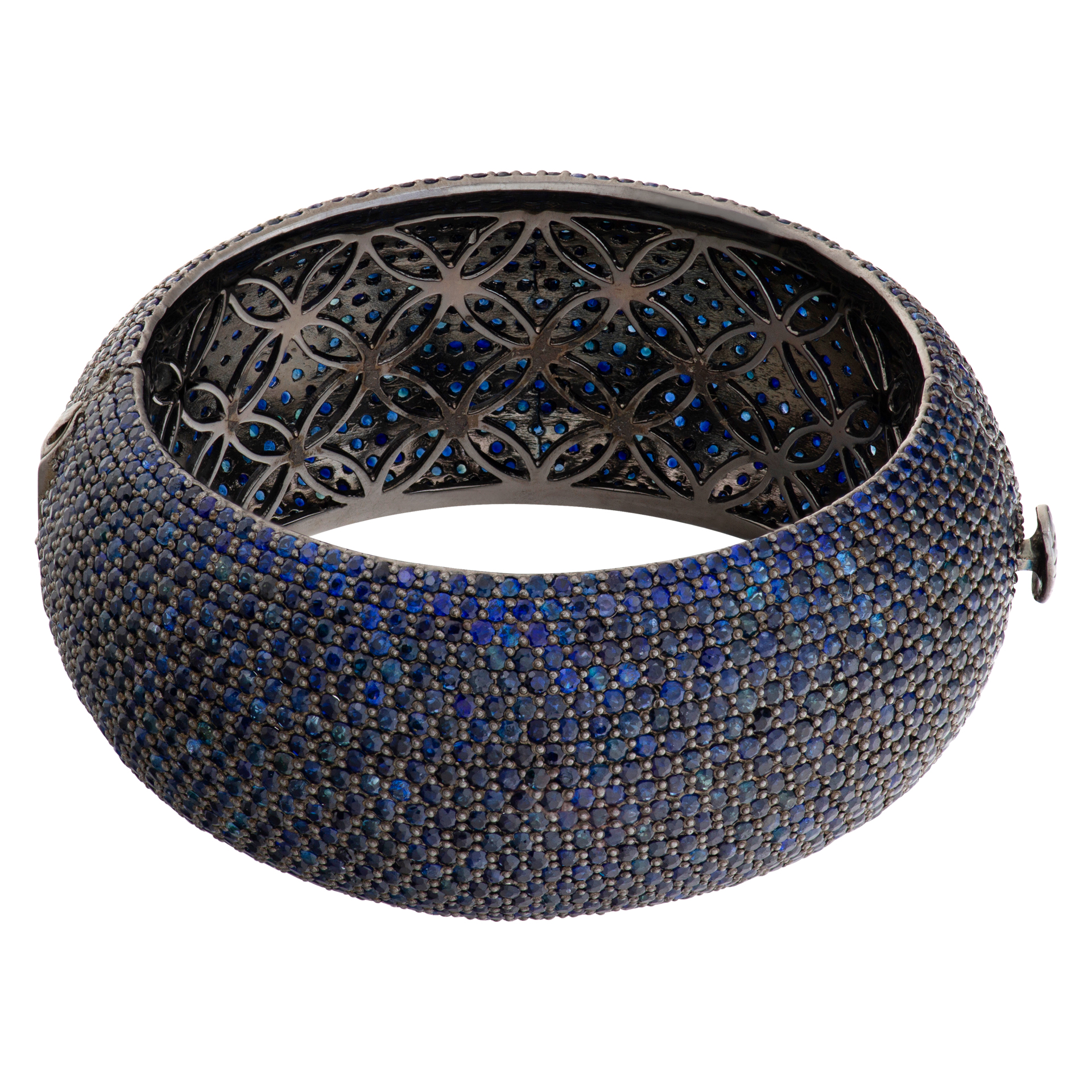 Wide cuff/bangle in blackened sterling silver with approx 57.84 carats round pave sapphires.
