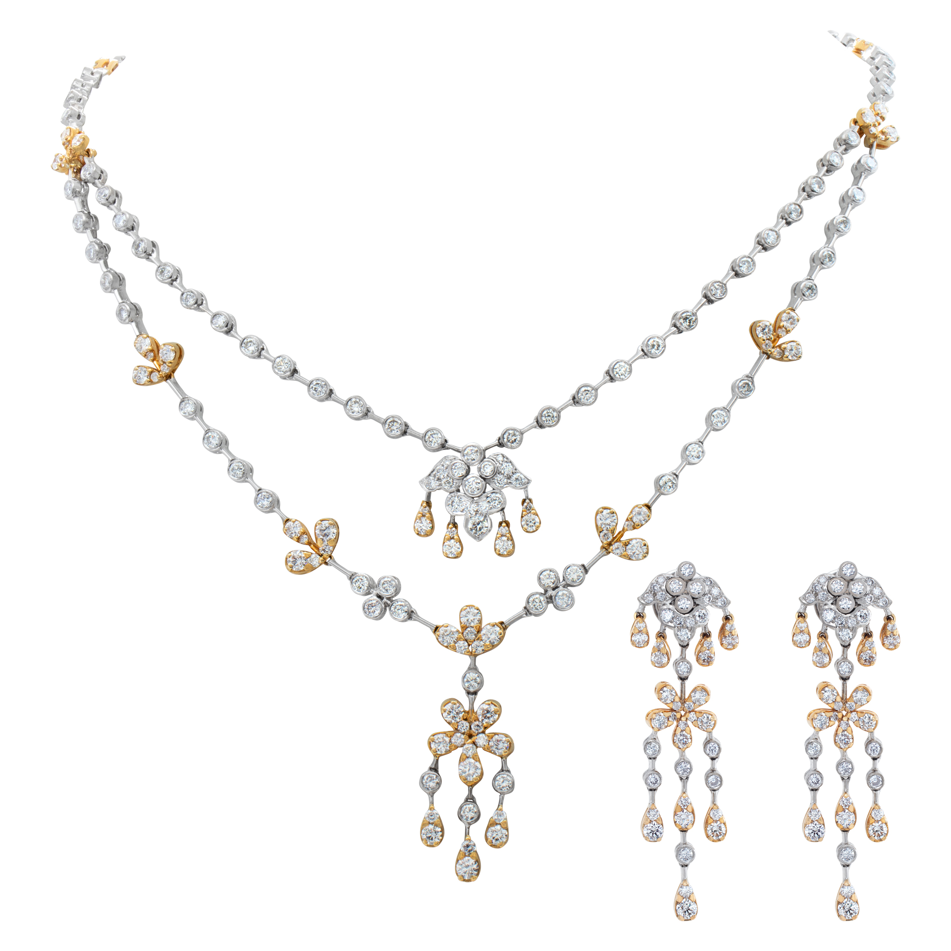Diamonds necklace and earrings parure, set in 18k white and yellow gold. Round brilliant cut diamonds total approximate weight: 14.60 carats