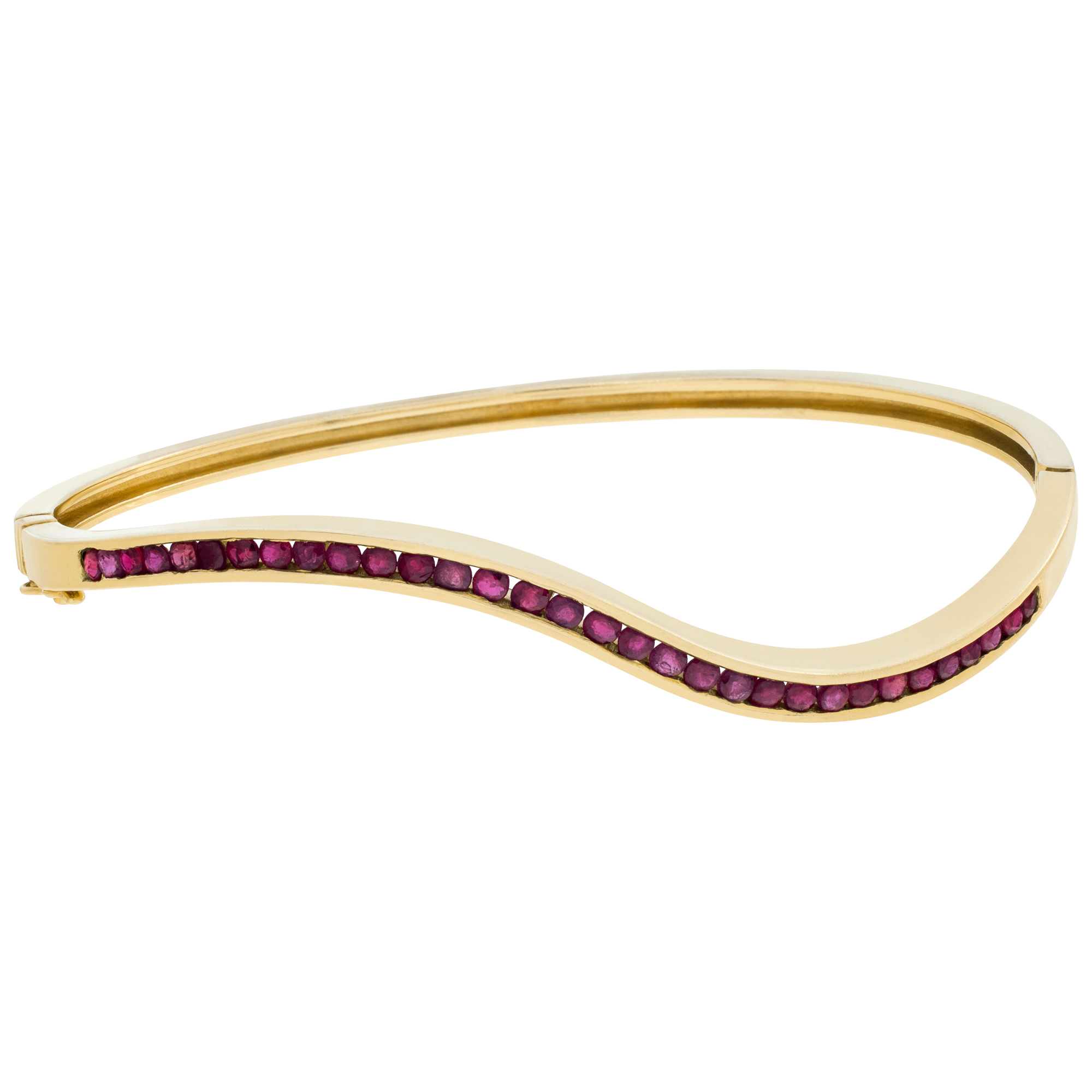 Waved 14k yellow gold bangle with over 1carat in red rubies