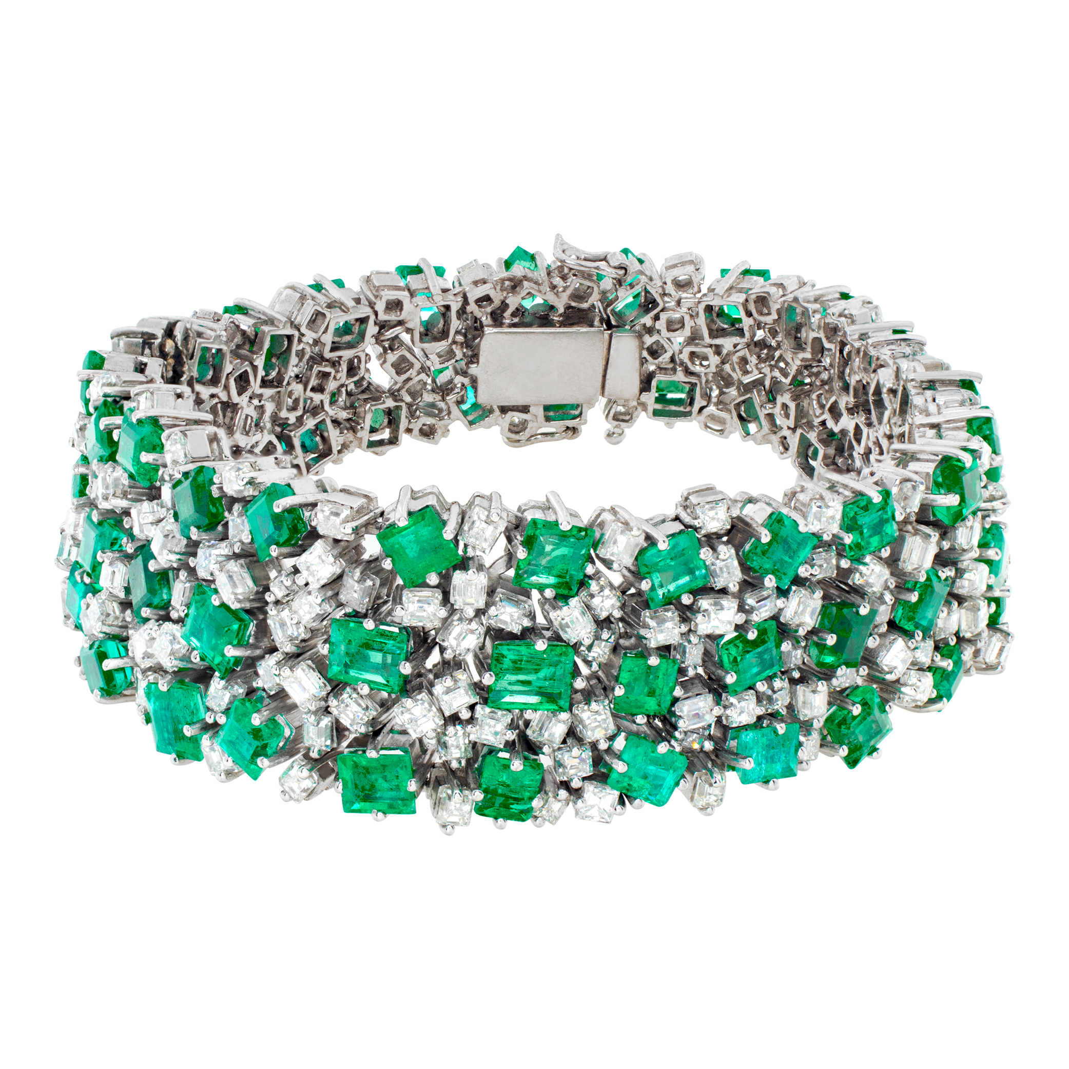 Vintage diamond and emerald platinum bracelet with over 17 carats in diamonds (H, VS) and 32 carats in Columbian emeralds. Length: 7 inches. Width tapers from 0.75 to 0.50 inches