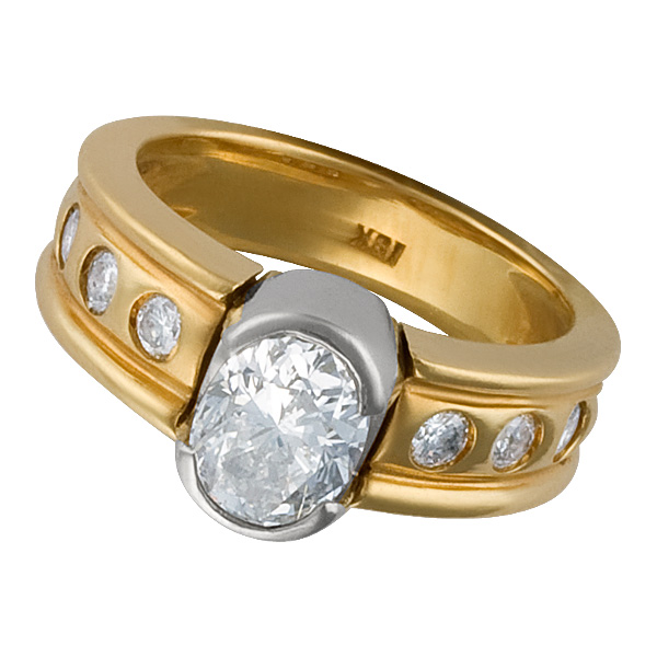 Semi Bezel set oval cut diamond ring in 18k yellow and white gold image 1