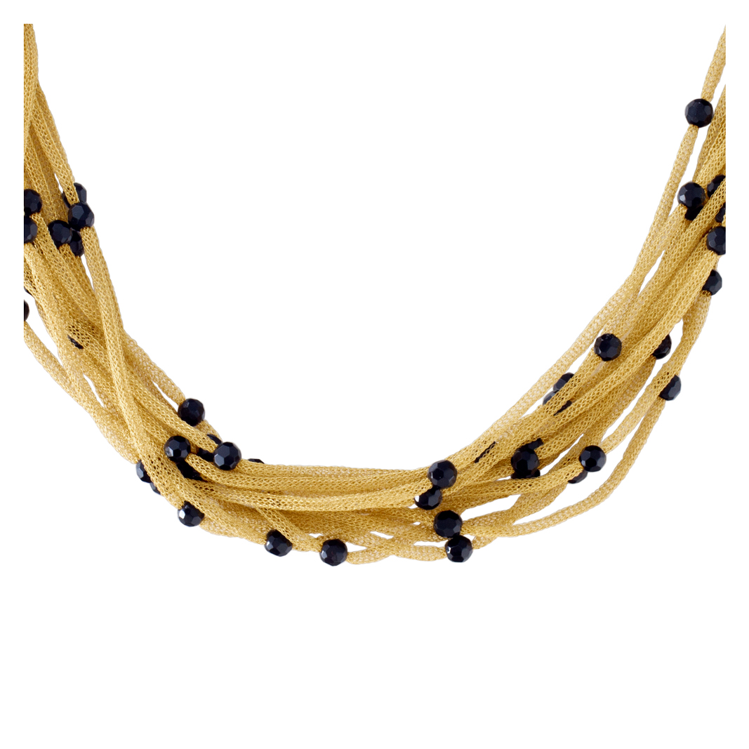 Multi-strand 18k gold necklace with faceted onyx bead stations.