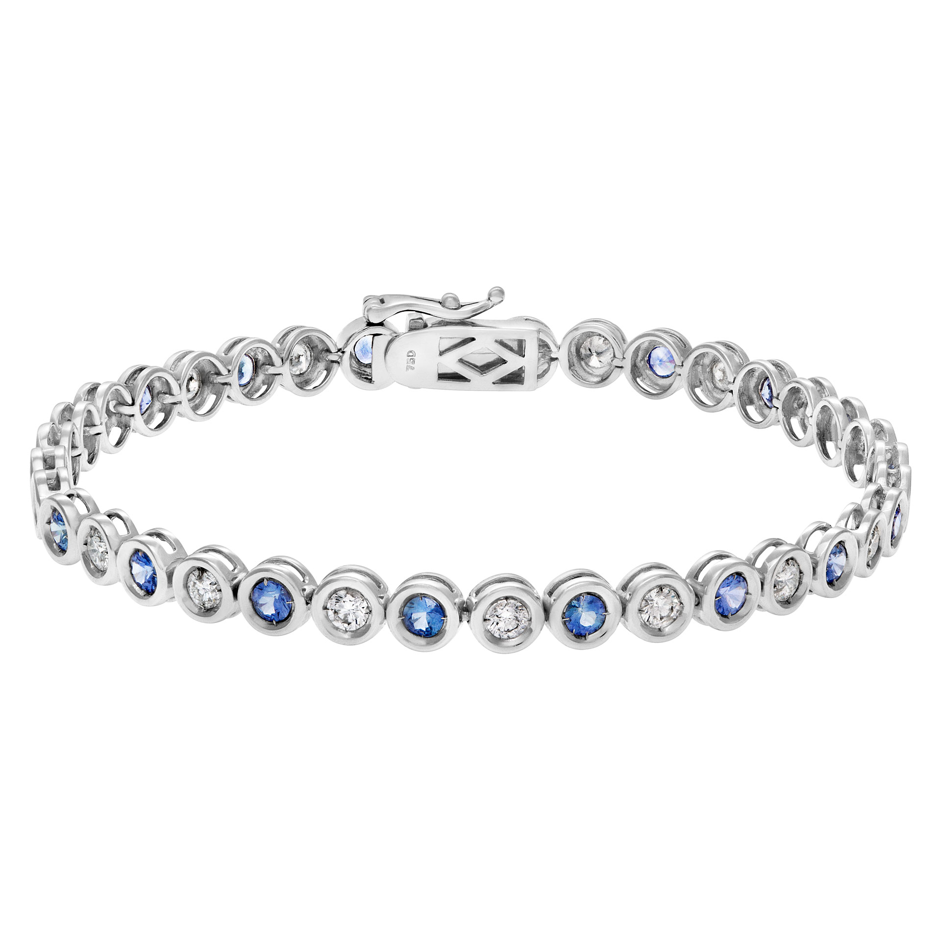 Bezel set blue sapphire and diamond line bracelet in 18k white gold.