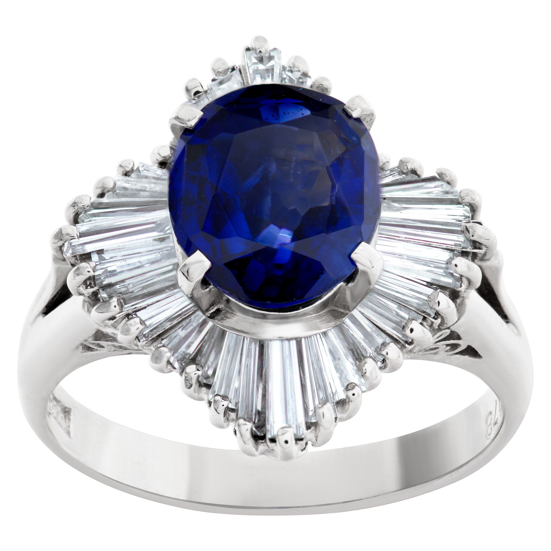 Deep blue oval sapphire ring with baguette diamonds in platinum