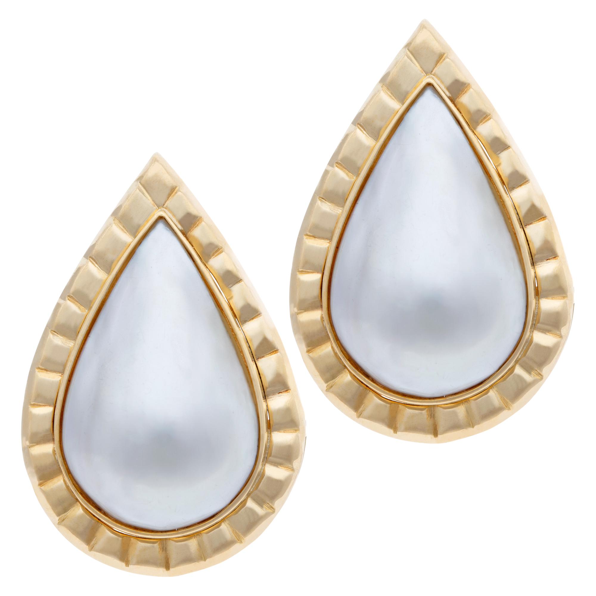 Pear shape Mobe pearl earrings set in ribbed 18K yellow gold. Post omega clip back.