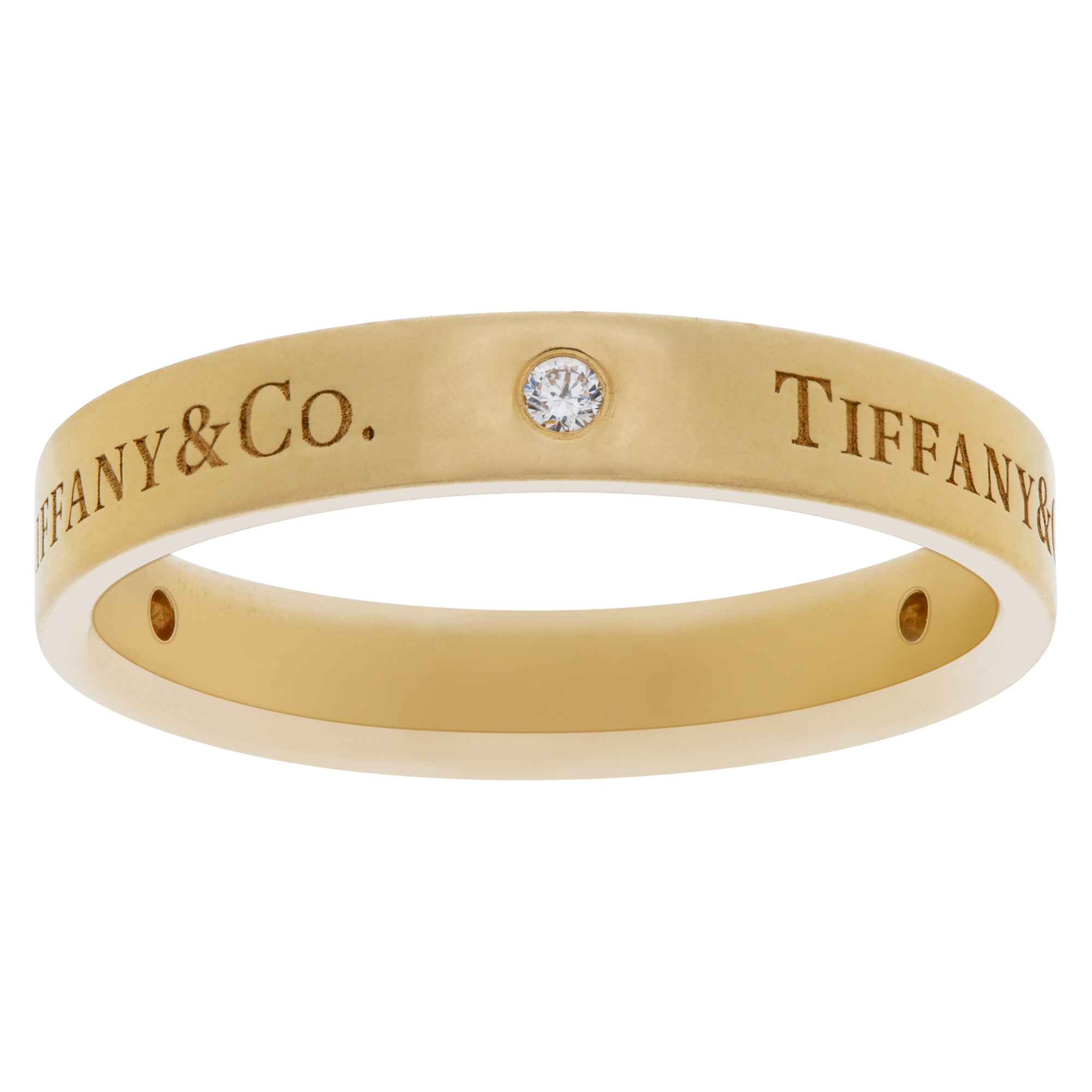 Tiffany & Co. 18k gold band ring with three round brilliant diamonds