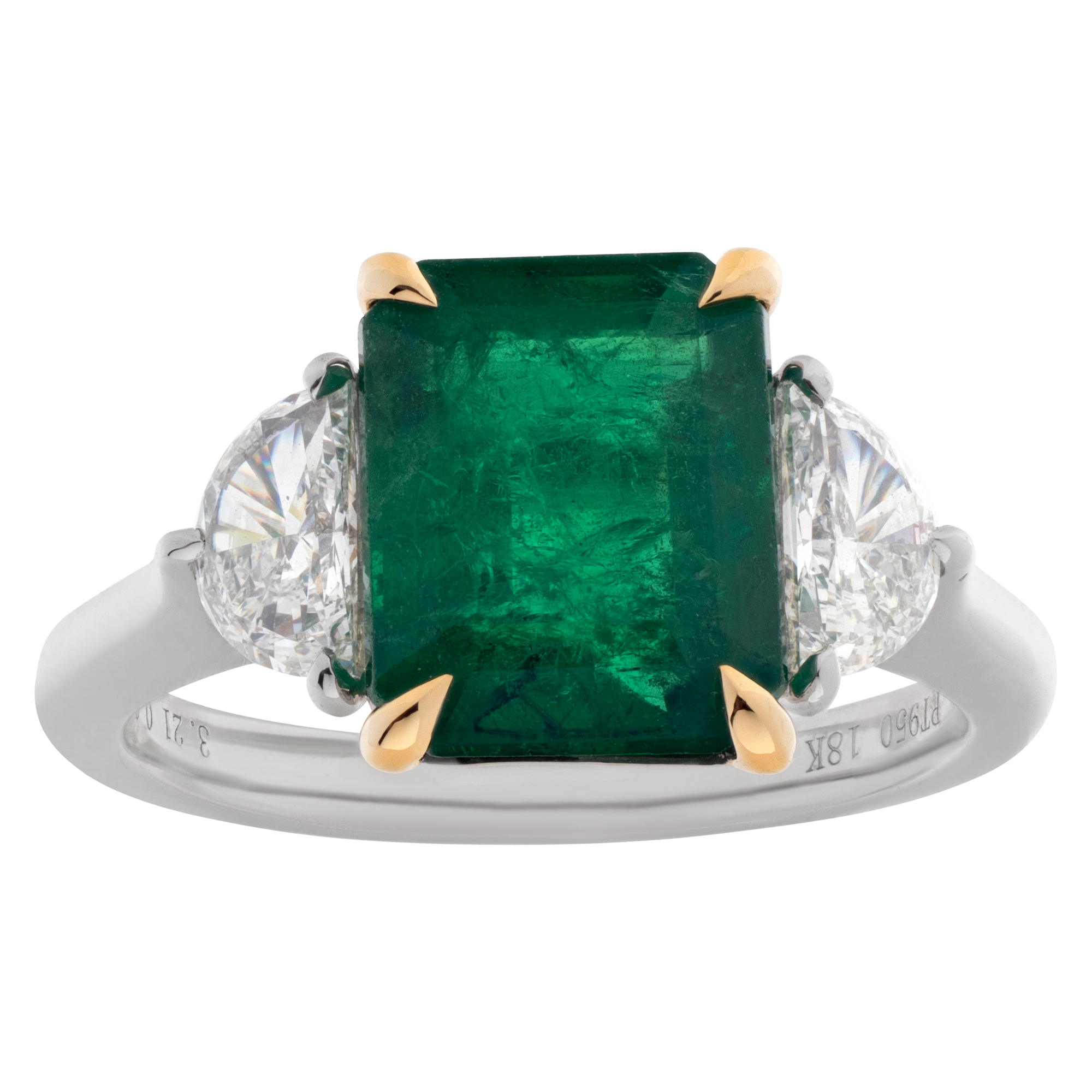 Emerald ring with diamond accents set in Platinum