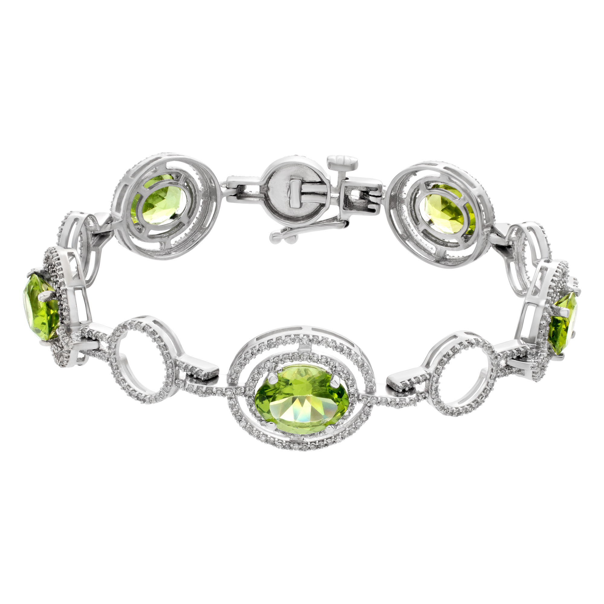 Peridot and diamond bracelet in 14k white gold. Oval brilliant cut Peridot total approx weight: 11.00 carats. Round brilliant cut diamonds total approx. weight over 2.20 carats