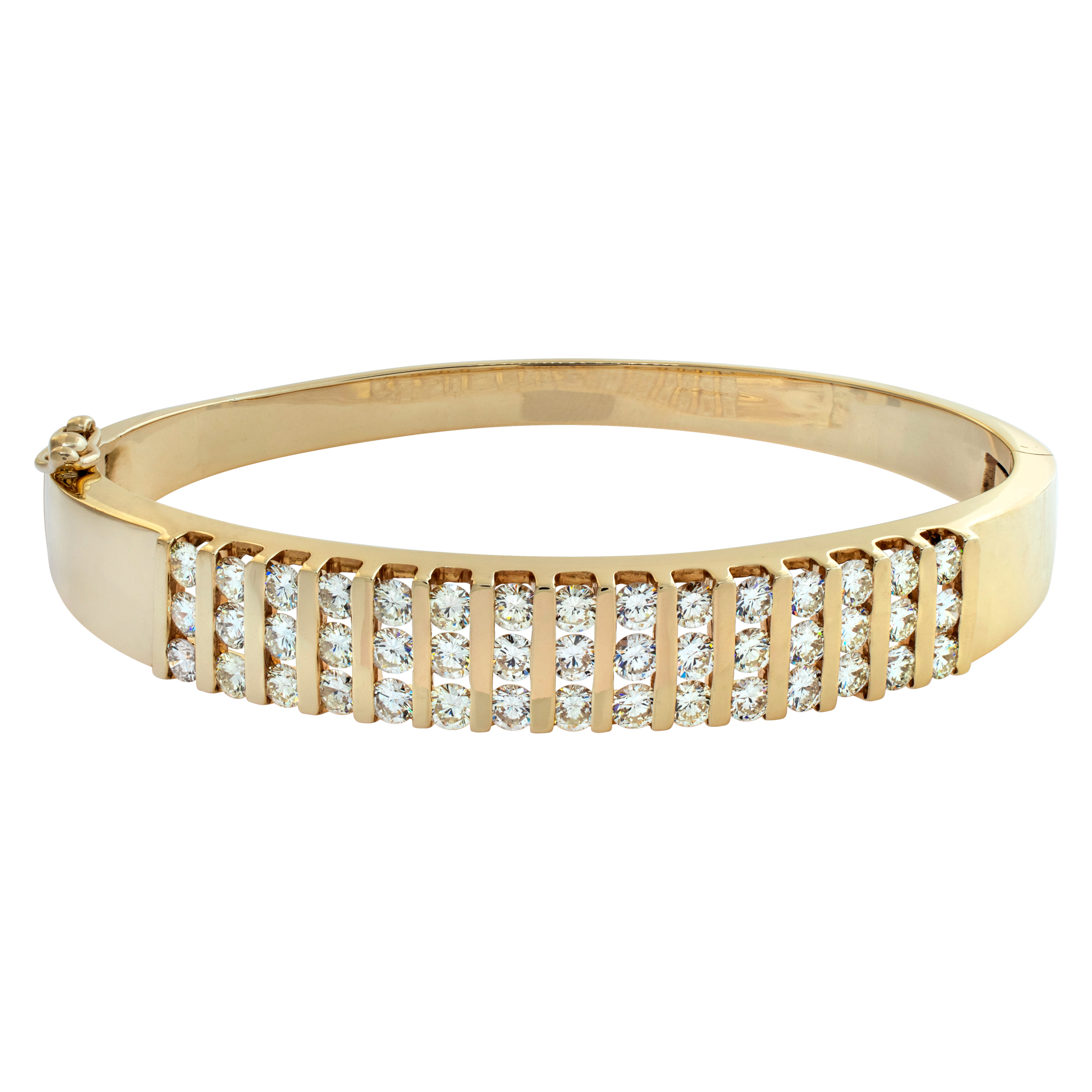 Round brilliant cut channel set bangle bracelet in 14k yellow gold. Round brilliant cut diamonds total approx. weight: 2.50 carats