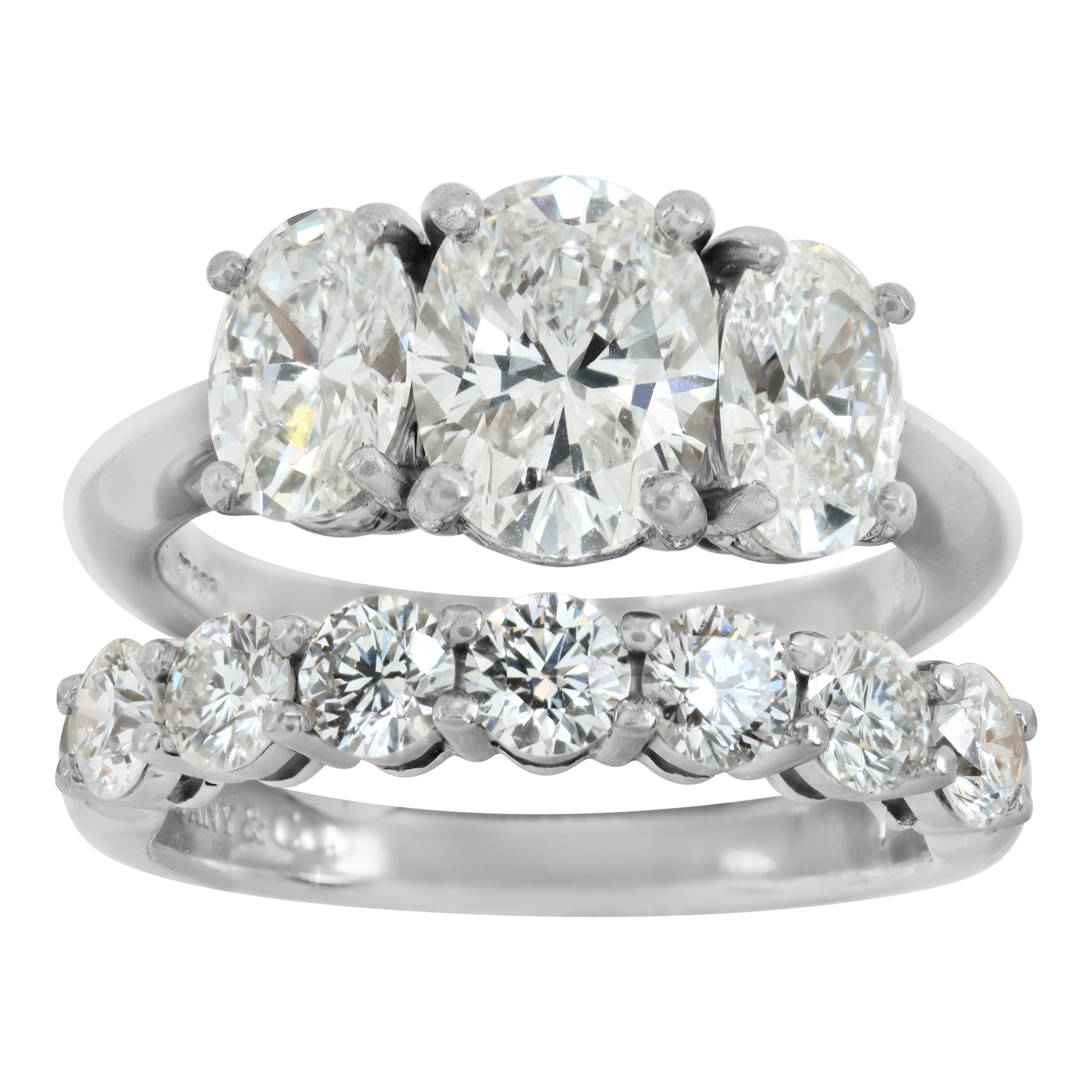 Tiffany & Co. diamond platinum ring set - three stone oval diamond engagment ring and semi eternity wedding band in platinum. (Stones)